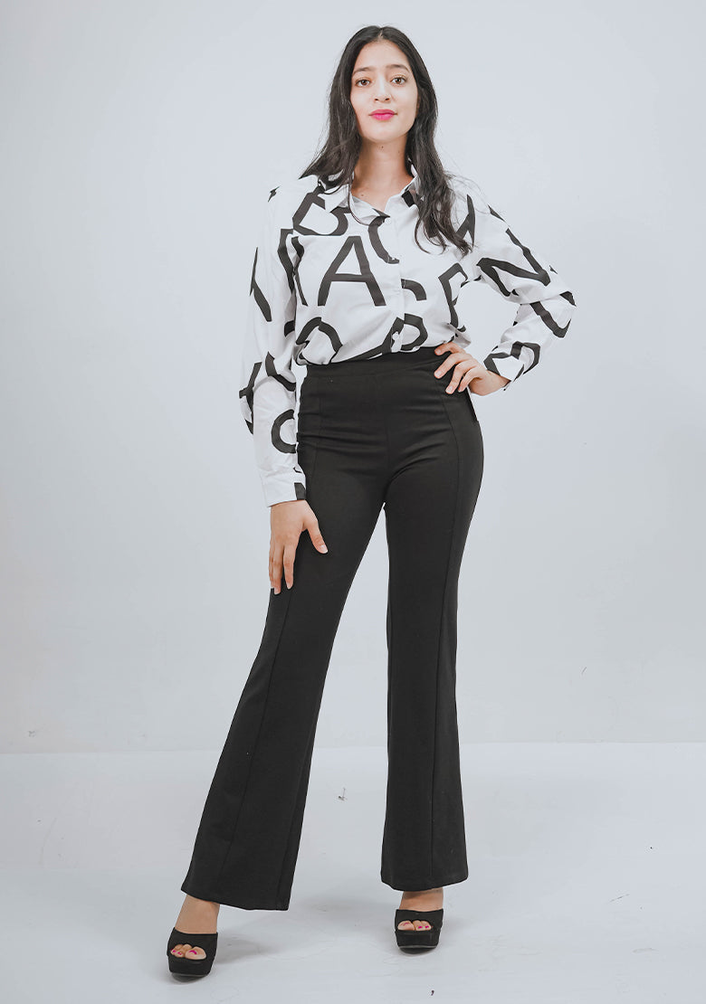 Camisa para dama Instyle F. con rayas negras, cuello clásico y mangas largas, estilo elegante y moderno.